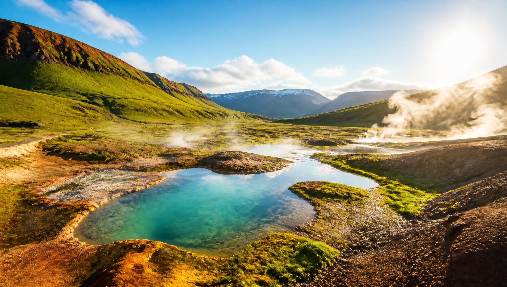 Steam rising from a geothermal river in a remote Icelandic valley